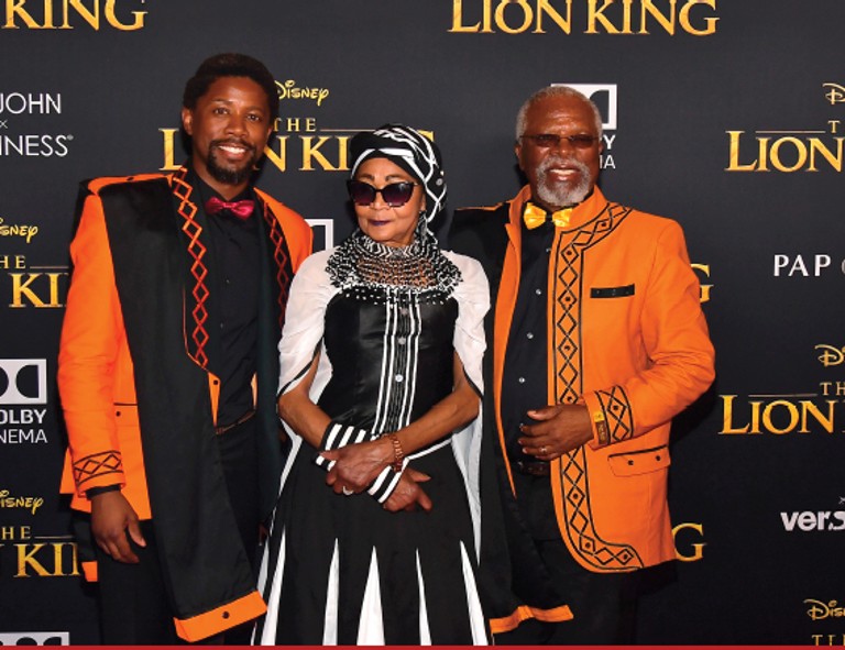 Kani (right) with his son Atandwa and his wife Mandi at the world premiere of The Lion King at the Dolby Theatre in Los Angeles, 2019. Reflecting on the craft of voice acting, Kani said it evoked the theatre, as it left much to the imagination. Photo: Matt Winkelmeyer/Getty Images