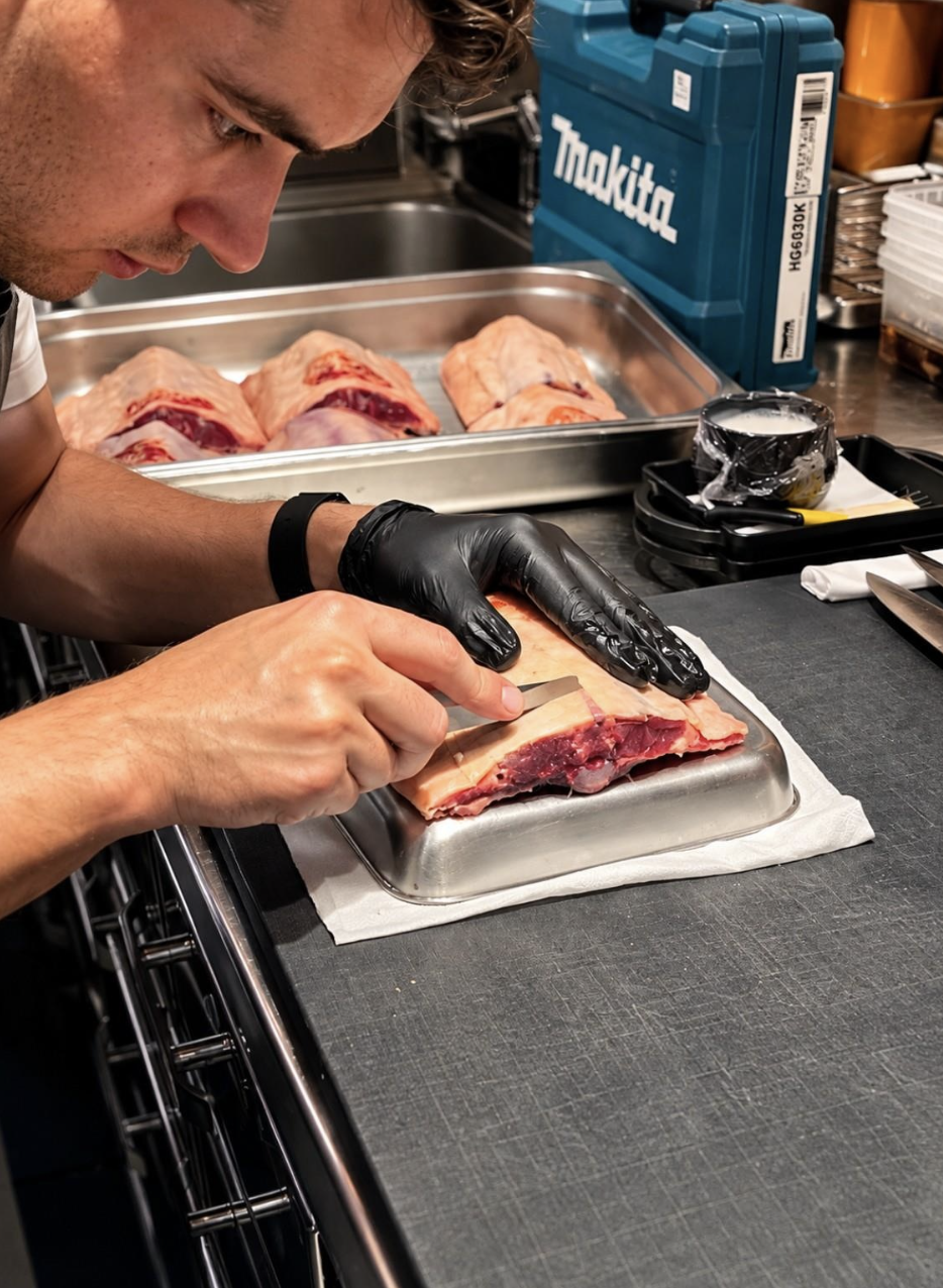 Behind the dining room, precision and preparation define the kitchen rhythm at Atlantis The Palm