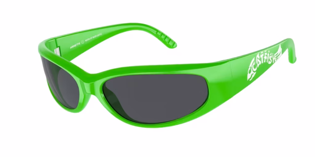 A pair of white, round-framed Arnette sunglasses with light brown tinted lenses and slightly translucent arms.