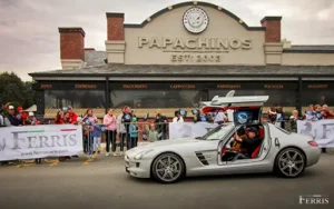 Supercar Rhino Run 2025: Mercedes-Benz SLS AMG with gull-wing doors at event, supporting rhino conservation.