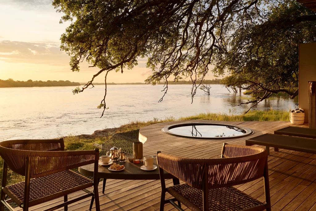 A private deck with a plunge pool overlooking the Zambezi River at the luxury Hippo Creek Villa safari Victoria Falls.