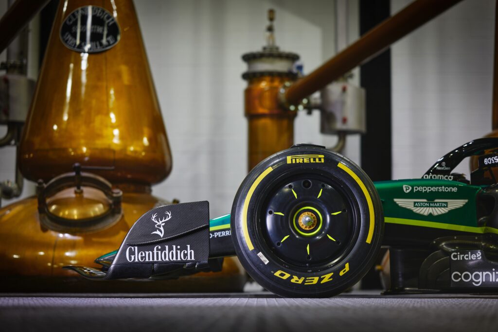 A close-up of the Aston Martin F1 car's front wing, featuring the iconic Glenfiddich logo and stag, symbolising the Glenfiddich Aston Martin partnership.