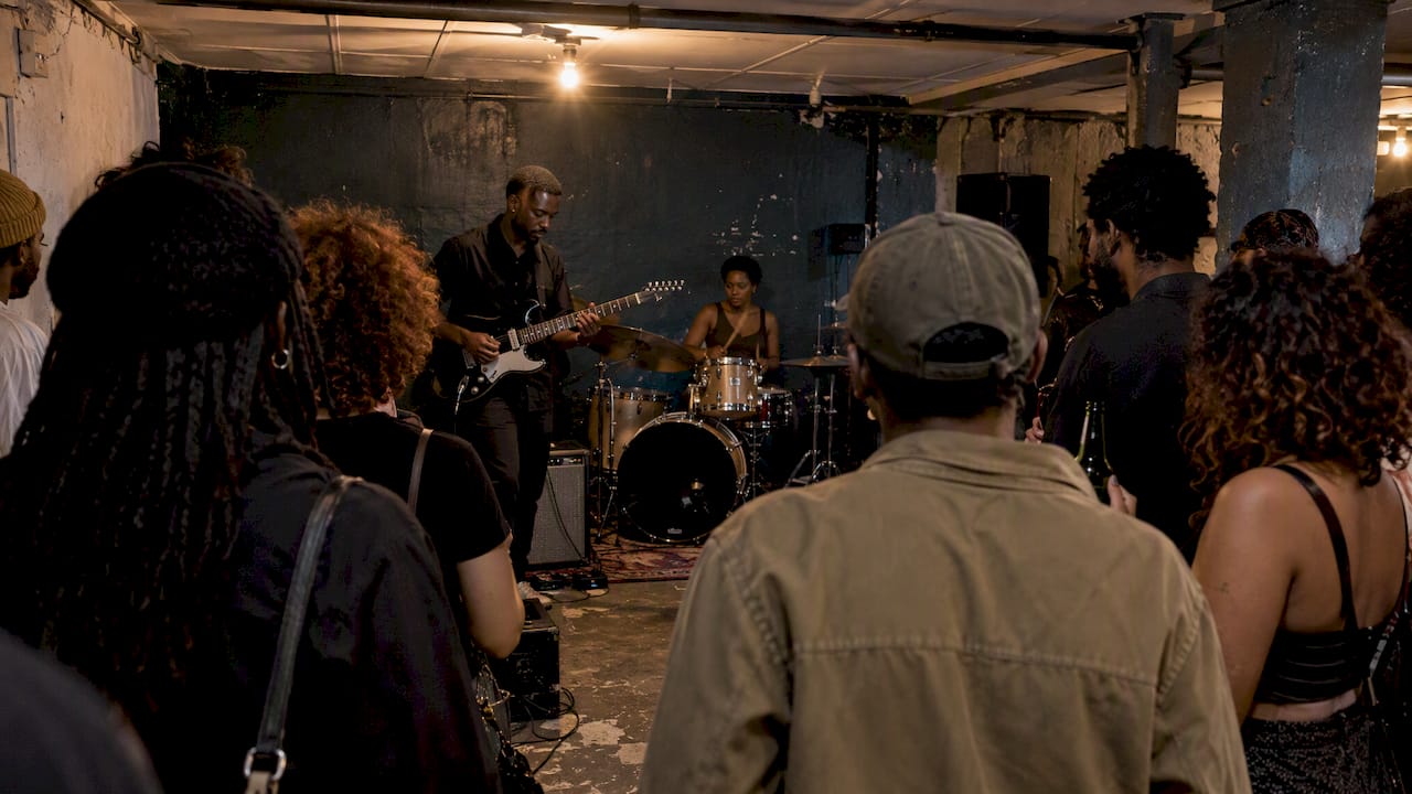 Musicians performing in a Braamfontein basement