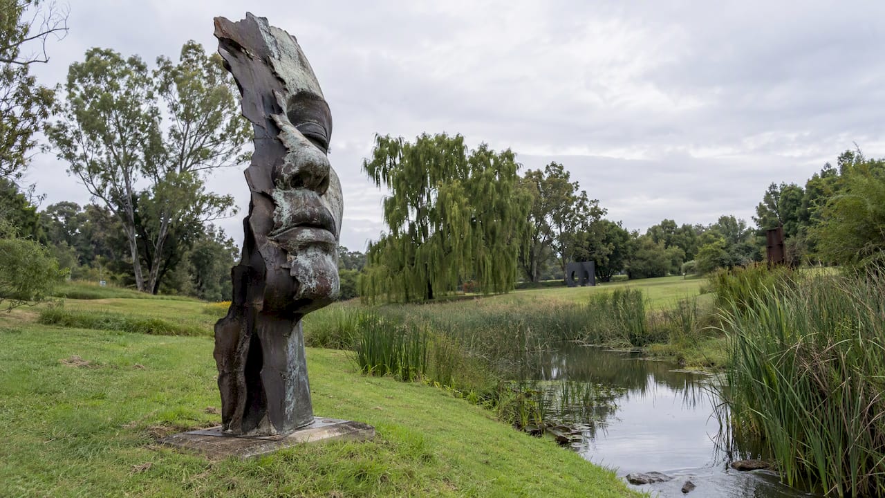 Contemporary sculpture beside water at NIROX
